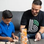 Big Brother and Little Brother playing jenga together