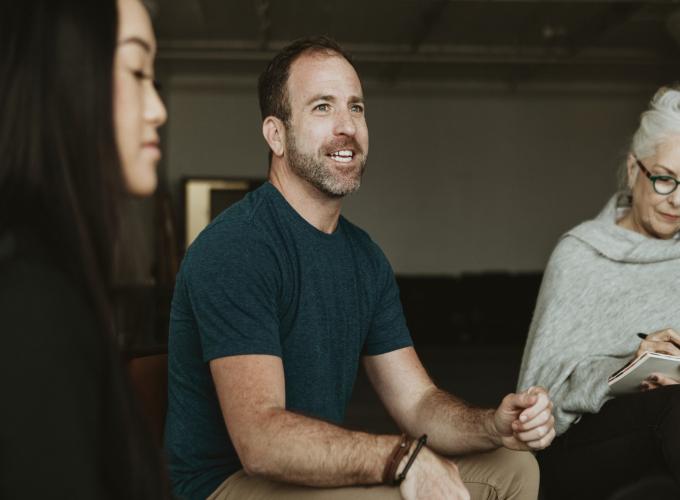 Man in group addiction recovery